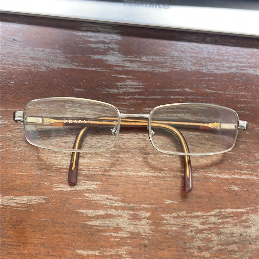 Prada VPR 551 purple/brown rectangular Silver eyeglasses.